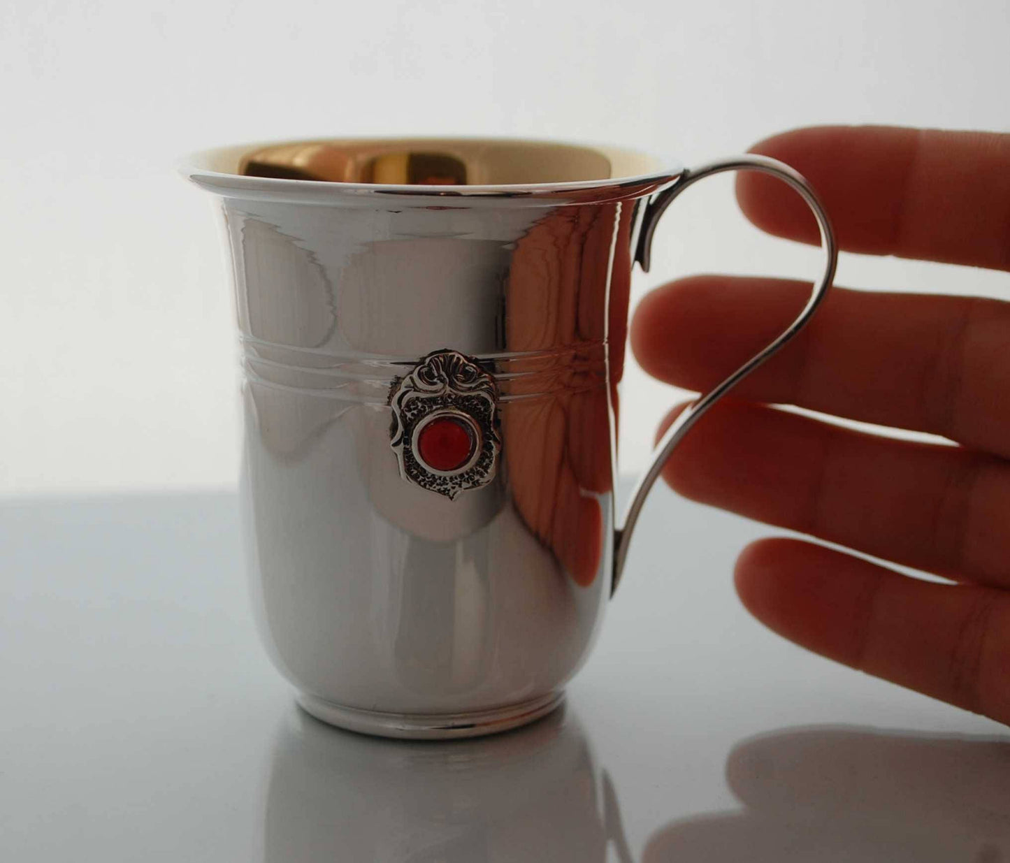 silver cup with ruby